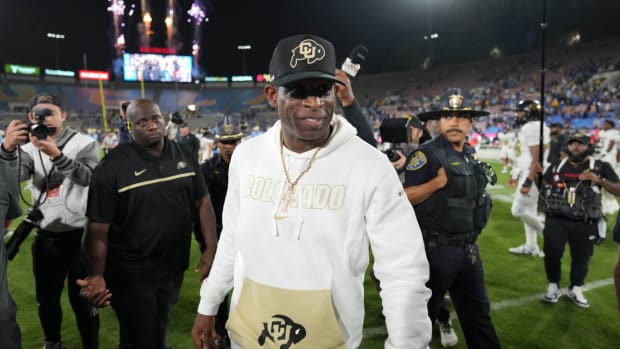 Colorado coach Deion Sanders leaves the field at the Rose Bowl after a loss to UCLA.